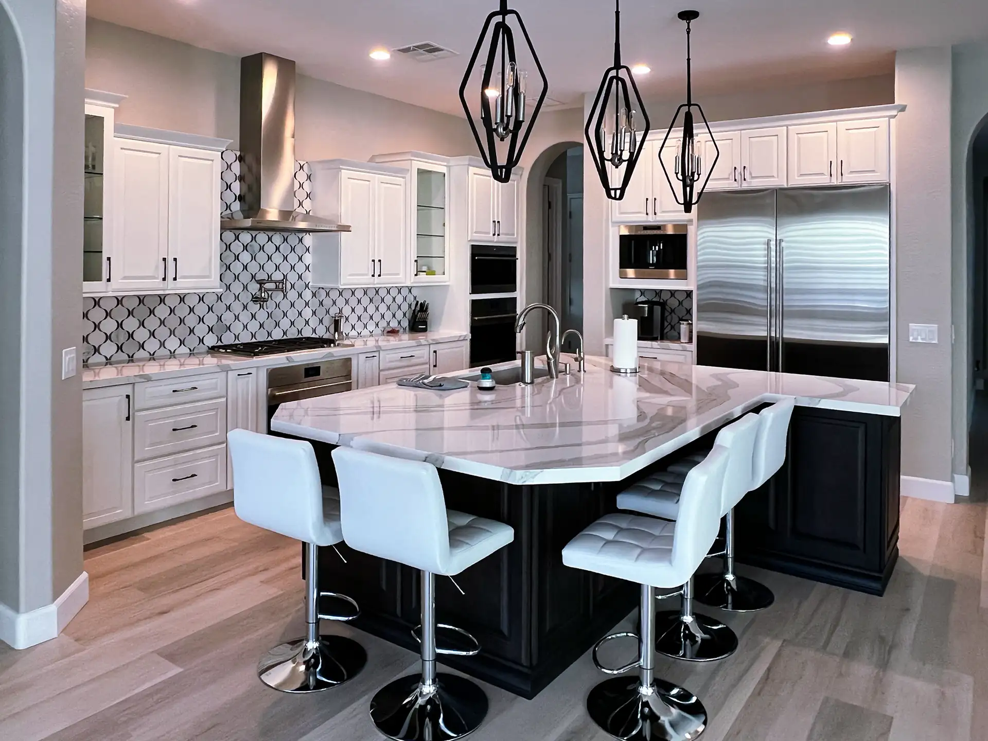 Transitional kitchen remodel with white cabinetry and large island
